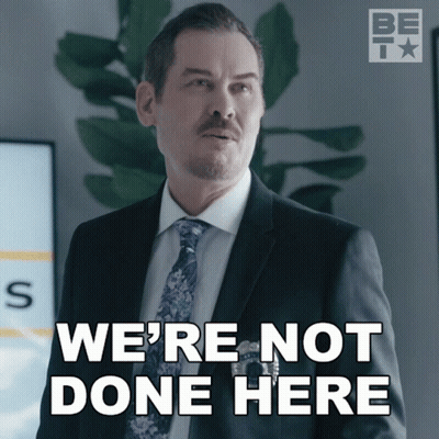 A Man In A Suit And Tie With The Words We 'Re Not Done Here GIF