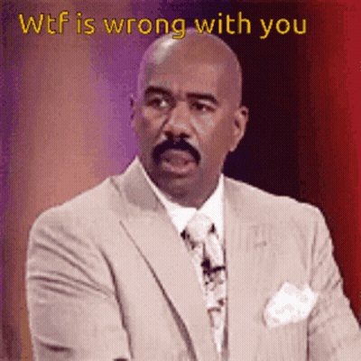 A Man In A Suit And Tie With The Words Wtf Is Wrong With You GIF
