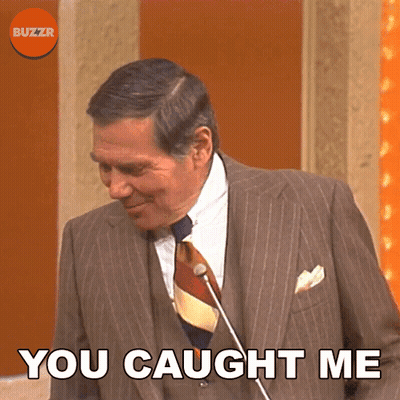 A Man In A Suit And Tie With The Words You Caught Me Below Him GIF