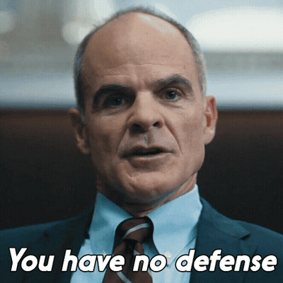 A Man In A Suit And Tie With The Words You Have No Defense Below Him GIF