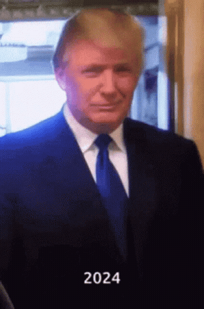A Man In A Suit And Tie With The Year 2024 Written On The Bottom GIF