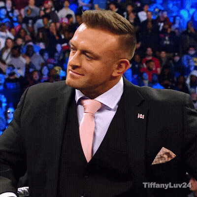A Man In A Suit And Tie With Tiffanyluv24 Written On The Bottom Right GIF