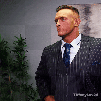 A Man In A Suit And Tie With Tiffanyluv24 Written On The Bottom Right GIF