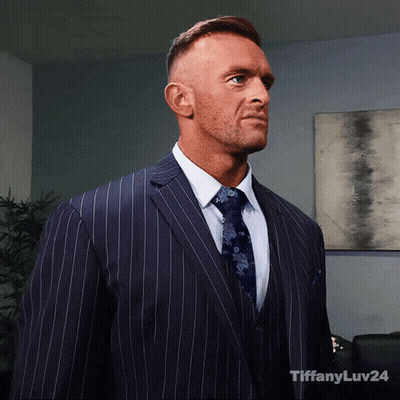 A Man In A Suit And Tie With Tiffanyluv24 Written On The Bottom Right GIF