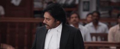 A Man In A Suit And White Shirt Is Giving A Speech GIF