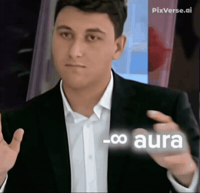 A Man In A Suit And White Shirt Is Pointing At Something With The Word Aura On It GIF