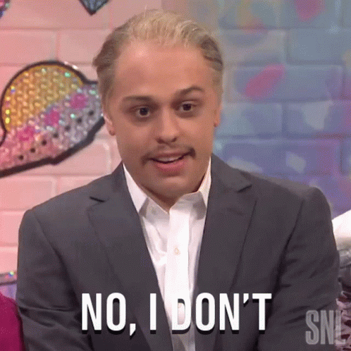 A Man In A Suit And White Shirt Is Saying No I Don 'T . GIF