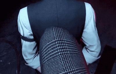 A Man In A Suit And White Shirt Is Sitting On A Woman 'S Lap GIF
