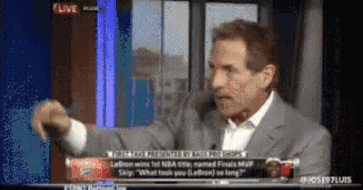 A Man In A Suit And White Shirt Is Talking On A Tv Screen GIF