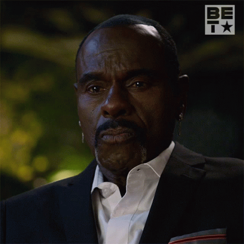A Man In A Suit And White Shirt Says No In White Letters GIF