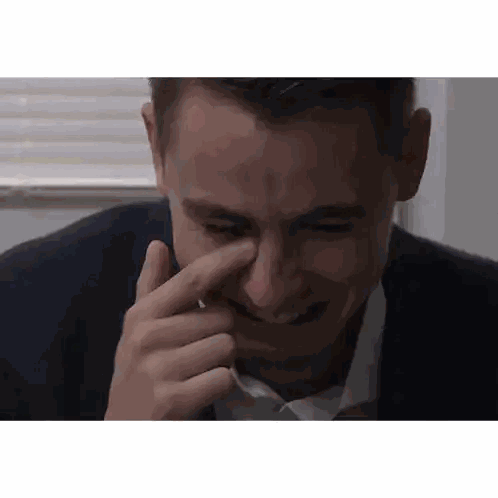 A Man In A Suit And White Shirt Wipes His Nose Sticker