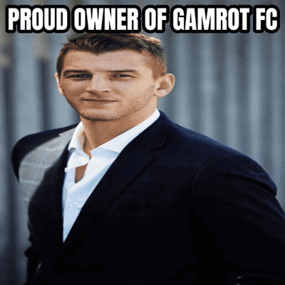 A Man In A Suit And White Shirt With The Words Proud Owner Of Gamrot Fc Above Him GIF