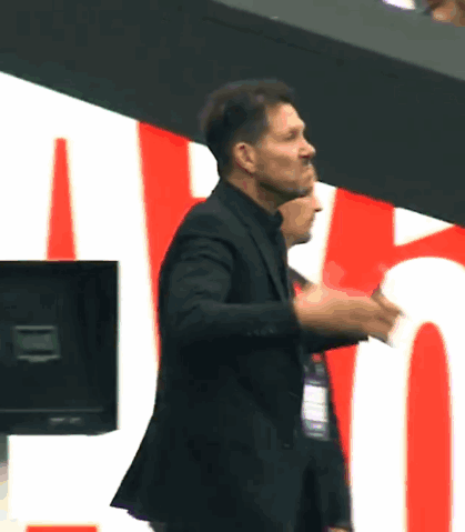 A Man In A Suit Giving A Thumbs Up Sign GIF