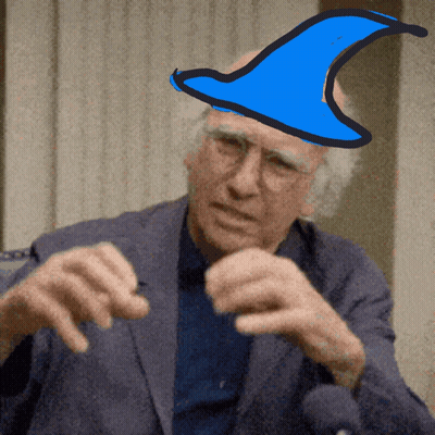 A Man In A Suit Has A Blue Hat On Top Of His Head GIF