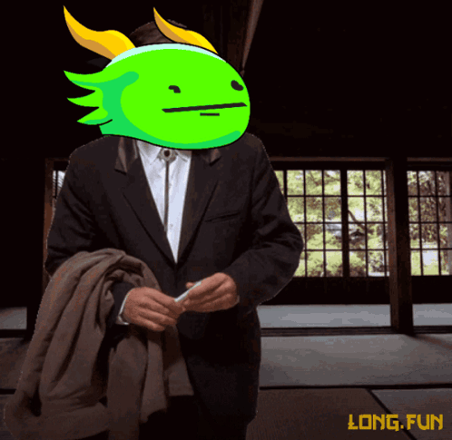 A Man In A Suit Has A Green Face On His Head With The Words Long Fun Below It GIF