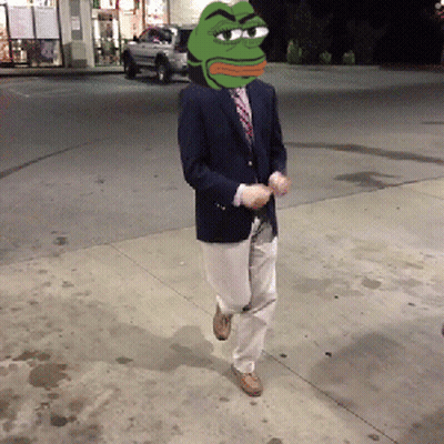 A Man In A Suit Has A Green Frog Head On His Head GIF