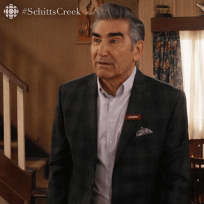A Man In A Suit Has A Name Tag That Says ' Daddy ' On It GIF