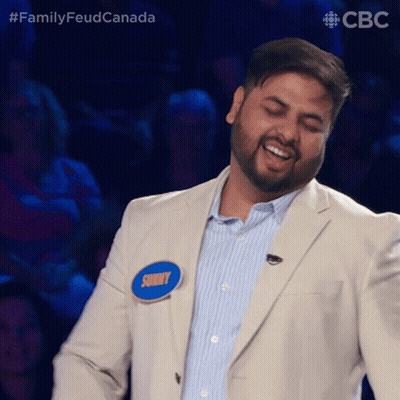 A Man In A Suit Has A Name Tag That Says Sunny On It GIF