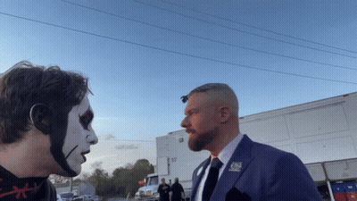 A Man In A Suit Has A Pin On His Lapel That Says Cbs GIF