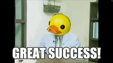 A Man In A Suit Has A Rubber Duck Head And Says Great Success GIF