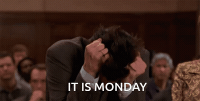 A Man In A Suit Has His Head In His Hands And The Words It Is Monday Behind Him GIF