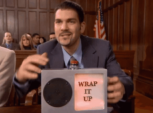 A Man In A Suit Holds A Box That Says " Wrap It Up " GIF