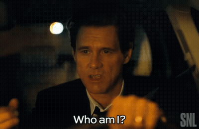 A Man In A Suit Is Asking Who Am I GIF