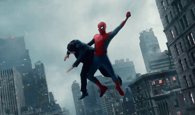 A Man In A Suit Is Being Held By A Spiderman GIF