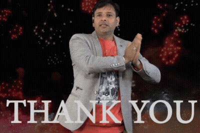 A Man In A Suit Is Clapping In Front Of A Thank You Sign GIF