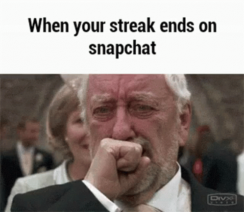 A Man In A Suit Is Crying While Holding His Fist To His Mouth . GIF