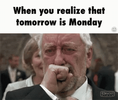 A Man In A Suit Is Crying With His Fist In His Mouth . GIF