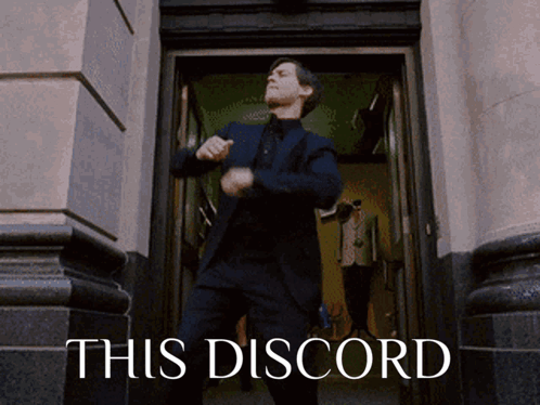A Man In A Suit Is Dancing In A Doorway With The Words This Discord Behind Him GIF