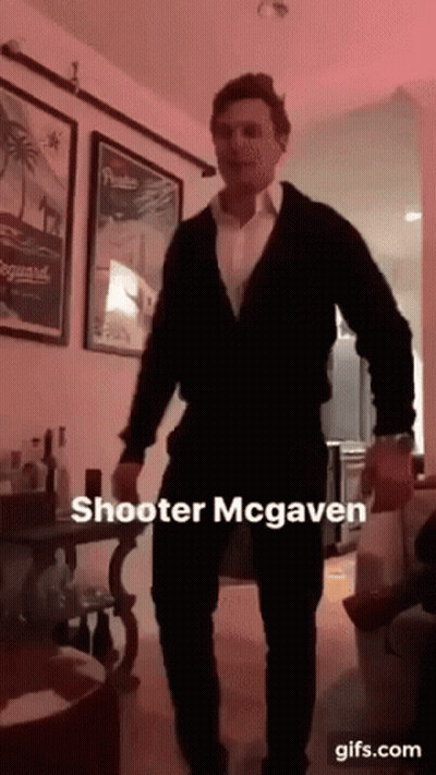 A Man In A Suit Is Dancing In A Living Room With A Caption That Says Shooter Mcgaven GIF