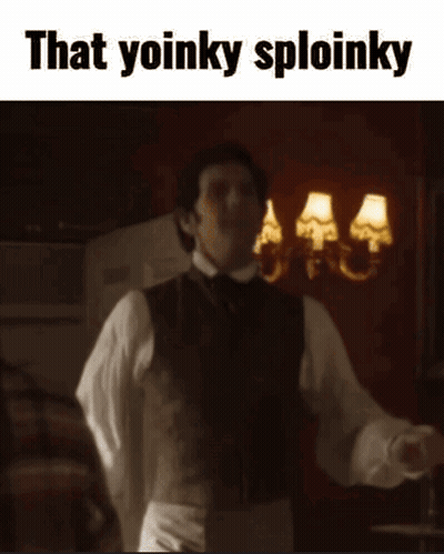 A Man In A Suit Is Dancing In A Room With The Words `` That Yoinky Sploinky '' Above Him . GIF