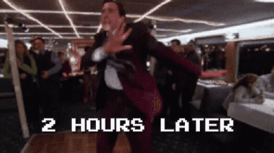 A Man In A Suit Is Dancing In Front Of A Sign That Says 2 Hours Later .. GIF