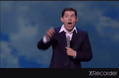 A Man In A Suit Is Dancing On A Stage With The Words " My Future Lies With Him " GIF