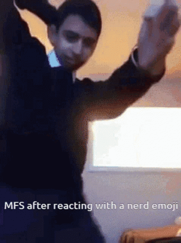 A Man In A Suit Is Dancing With A Nintendo Wii Controller In His Hand .. GIF