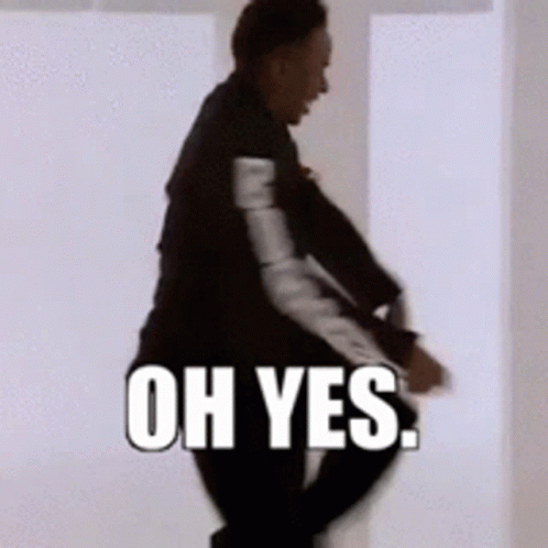 A Man In A Suit Is Dancing With The Words Oh Yes Behind Him GIF