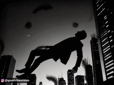 A Man In A Suit Is Falling Through The Air In A City GIF