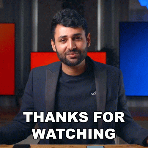 A Man In A Suit Is Giving A Thanks For Watching Sign GIF