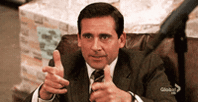 A Man In A Suit Is Giving A Thumbs Up GIF
