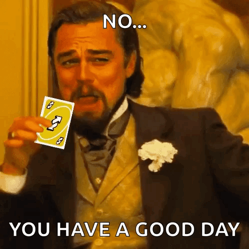 A Man In A Suit Is Holding A Card That Says Uno GIF