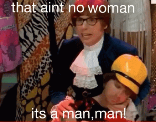 A Man In A Suit Is Holding A Child With The Words That Ain T No Woman Its A Man Man GIF