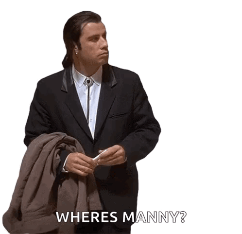 A Man In A Suit Is Holding A Coat And Asking Where Manny GIF