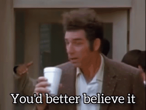 A Man In A Suit Is Holding A Cup Of Coffee And Saying You 'D Better Believe It . GIF