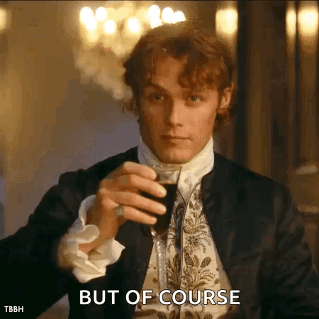 A Man In A Suit Is Holding A Glass Of Wine And Saying But Of Course . GIF