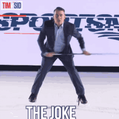A Man In A Suit Is Holding A Hockey Stick In Front Of A Sports Radio Logo GIF