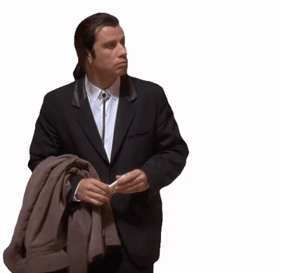A Man In A Suit Is Holding A Jacket And A Cigarette . GIF