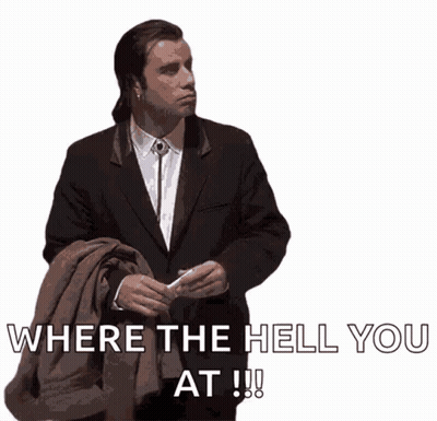 A Man In A Suit Is Holding A Jacket And Says Where The Hell You At !!! GIF