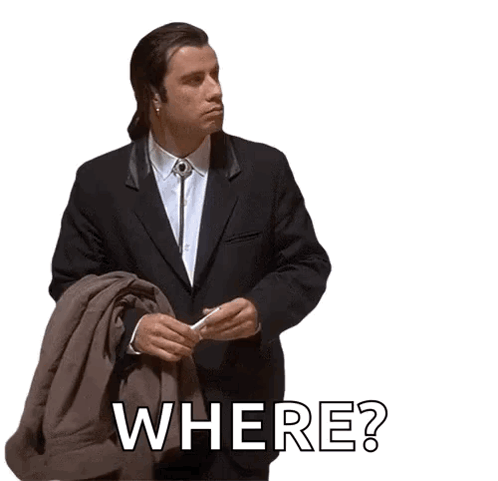 A Man In A Suit Is Holding A Jacket And The Word Where Is On The Bottom GIF